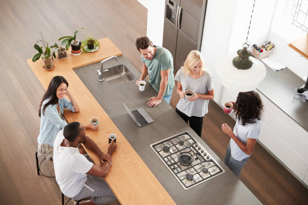 istock Overhead View Of Friends Drinking Coffee In Modern Kitchen 844050446