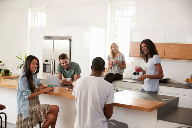 istock Friends Talking And Drinking Coffee In Modern Kitchen 844050510