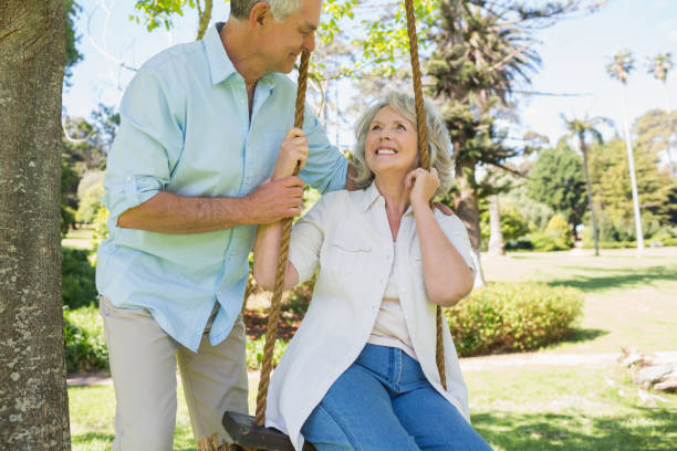 istock Loving mature couple at park 844053184
