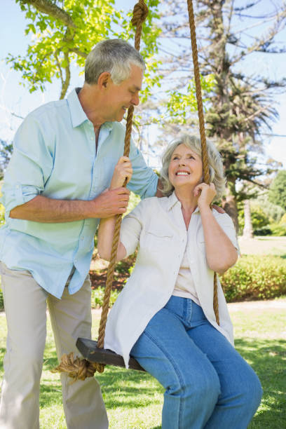 istock Loving mature couple at park 844053502