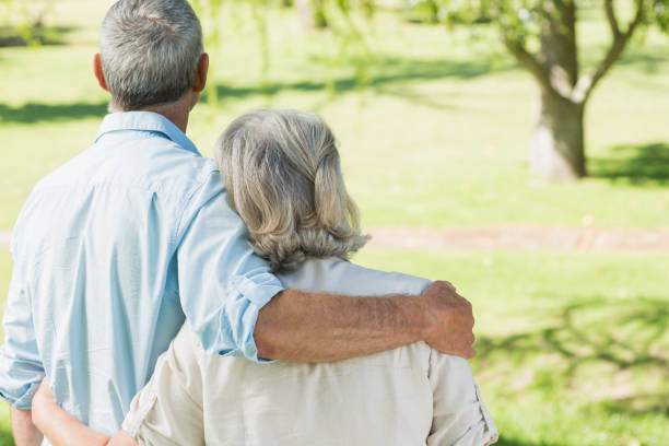istock Loving mature couple at summer park 844053954