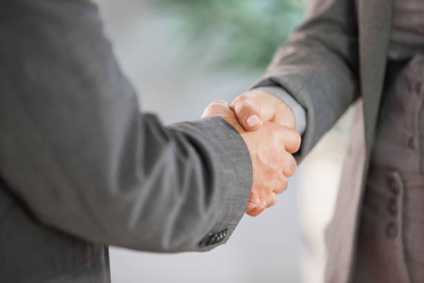 istock Business people shaking hands close up 844054990