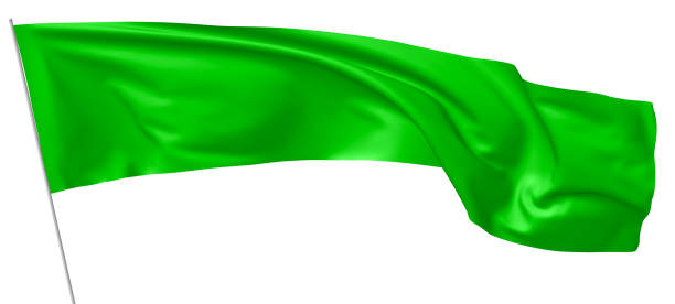 istock Long green flag on flagpole waving in wind. 844057334