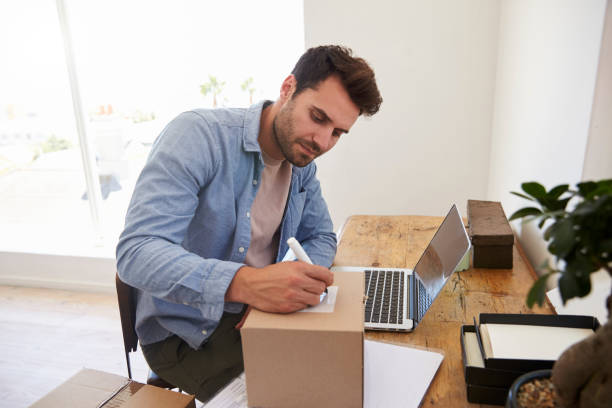istock Man In Bedroom Running Business From Home Labeling Goods 844058080