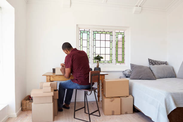 istock Man In Bedroom Running Business From Home Labeling Goods 844058192
