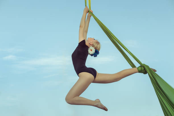 istock Sportswoman the equilibrist on a hammock. 844058710