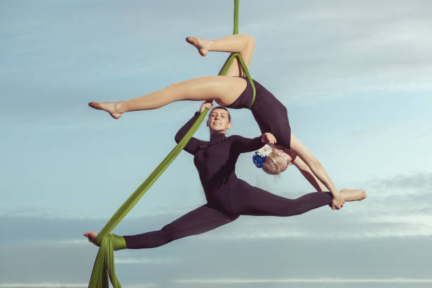Two women are air gymnasts.