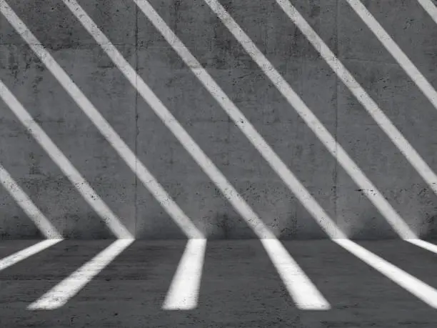 Photo of Empty room, pattern of shadows and light beams