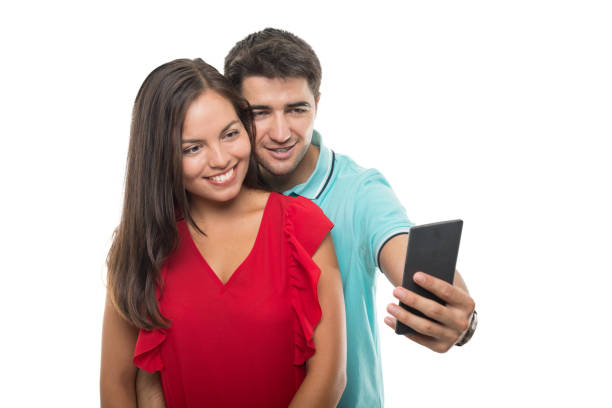 istock Handsome young couple taking selfie with smartphone 844062744