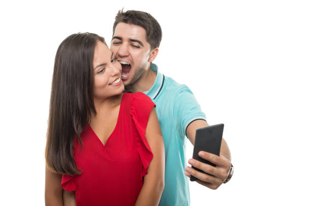 istock Attractive young couple taking selfie being playful 844062784