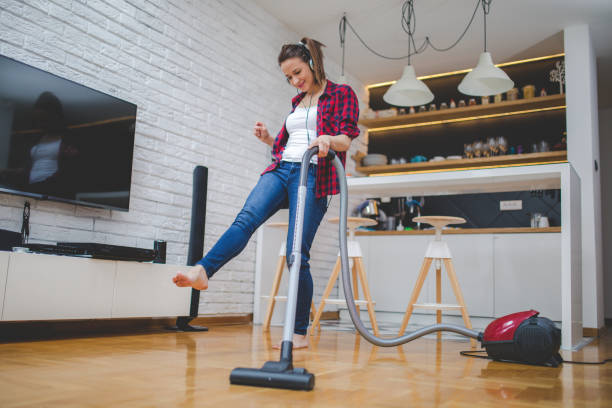 istock Happy woman cleaning house 844063318