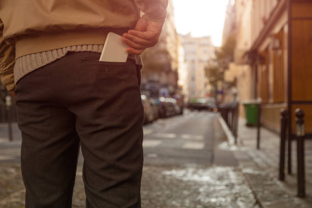 istock Modern guy using cellphone in the European city. 844068394