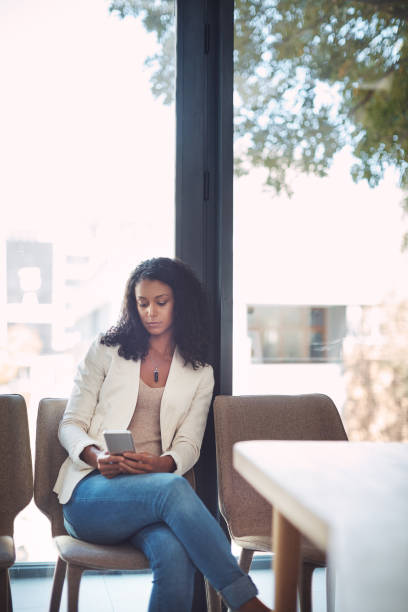 istock Cellphones are so handy when you waiting 844068710