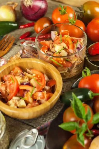 Fresh tomato salad with tuna and cheese. Diet food. Healthy breakfast