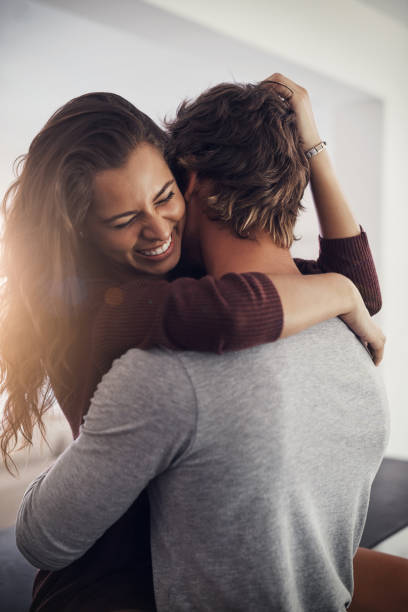 Say you'll never let me go Cropped shot of an affectionate young couple at home clingy girlfriend stock pictures, royalty-free photos & images