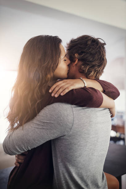 I can't imagine my life without you Cropped shot of an affectionate young couple at home clingy girlfriend stock pictures, royalty-free photos & images
