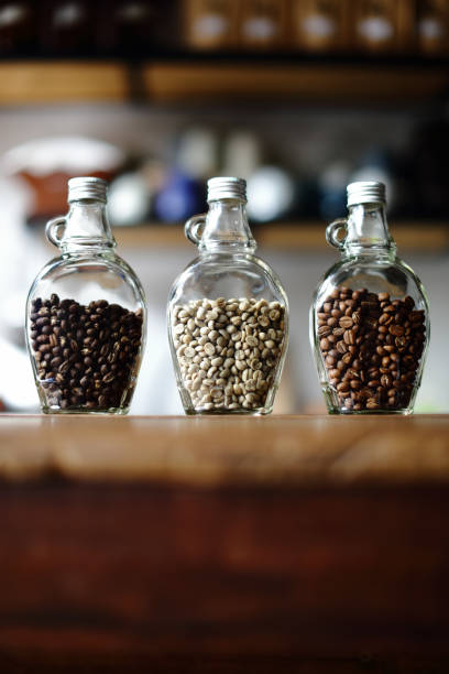 istock Green beans and Coffee beans inside the clear bottle , Focus only subject blur background,Copy Space for Text Layout, Chiangmai ,Thailand 844085446