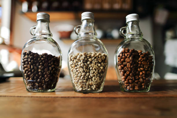 istock Green beans and Coffee beans inside the clear bottle , Focus only subject blur background,Copy Space for Text Layout, Chiangmai ,Thailand 844085458