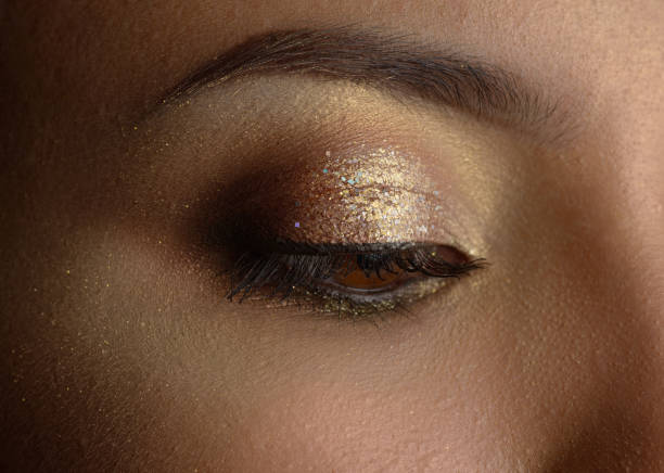 istock Woman with golden makeup. 844085758