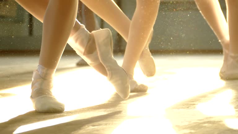 close-up - ballerinas feet in the rays of light