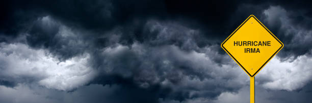 hurrican irma panoramic road sign in front of storm clouds - hurrican imagens e fotografias de stock