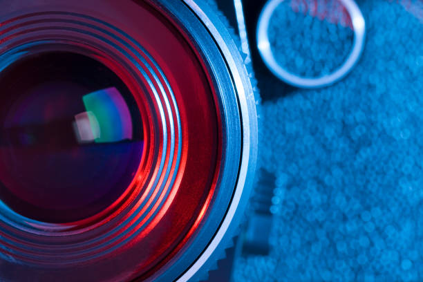 istock Closeup of retro camera lens with red and blue lighting 844092164