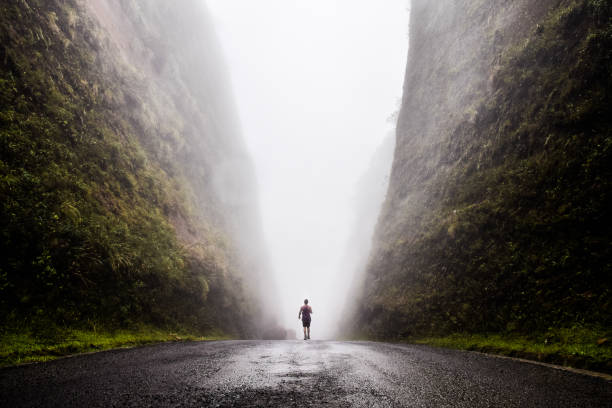 Photo of Walking into the unknown, walking between two huge cliffs of rock while a cloud passes in between of them, Urubici, South of Brazil, Brazil, South America.