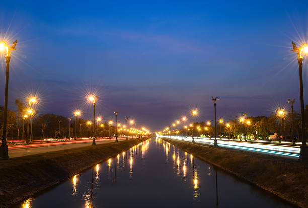 istock Sunset over a highway Utthayan Road and reflection on the river. 844098630