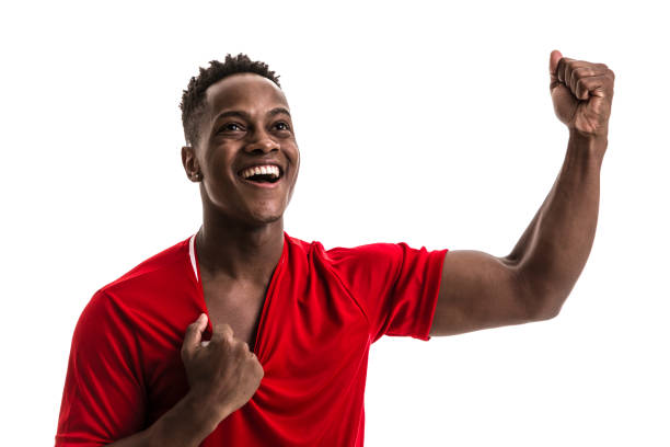 istock Fan / Sport Player on red uniform celebrating on white background 844103084