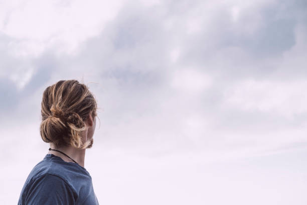 istock Man looking at the view, Fistral Beach, Newquay, Cornwall. 844103576