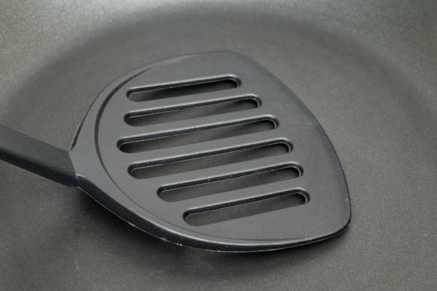 istock close-up of flipper use in frying pan 844106454