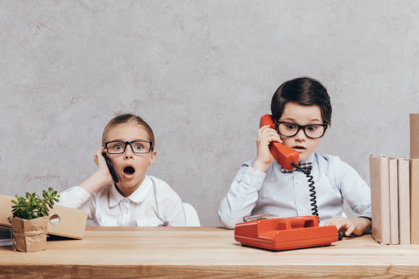 istock children talking on smartphone and telephone 844106798