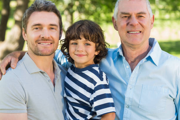 istock Grandfather father and son smiling at park 844110180