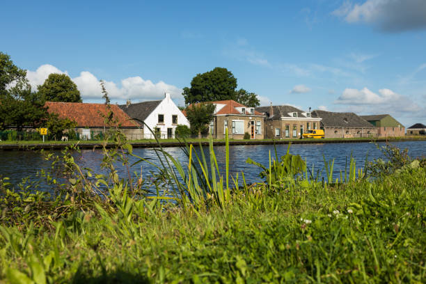 istock Dutch typical houses by the river bank 844110238