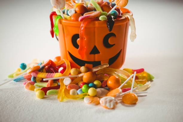 istock Orange bucket with various sweet food during Halloween 844113268