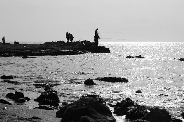 istock Fishermen near by sea  in twilight 844113866