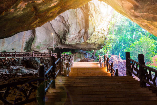 istock Stair walk way in nature cave , light and flare effect 844113944