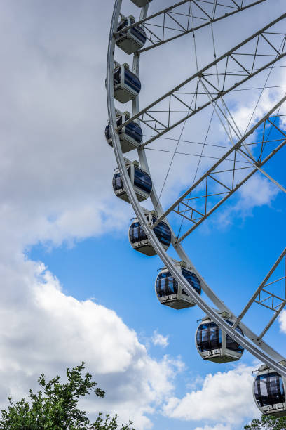 istock Ferris wheel in the amusement park with blue sky at the background 844114464