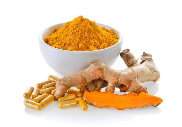 istock Turmeric powder and turmeric capsules on white background 844121298