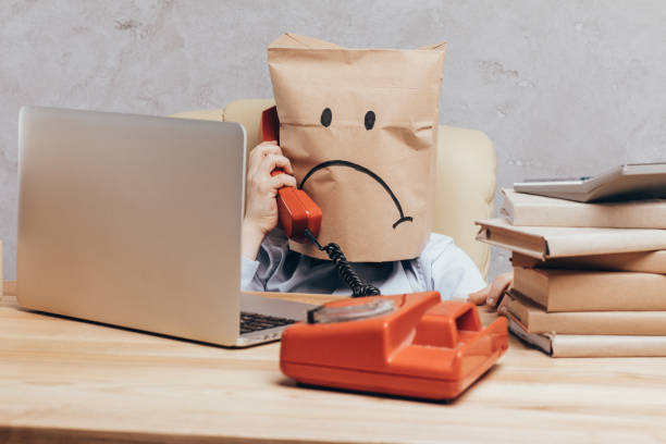 istock child with paper bag on head with telephone 844125100