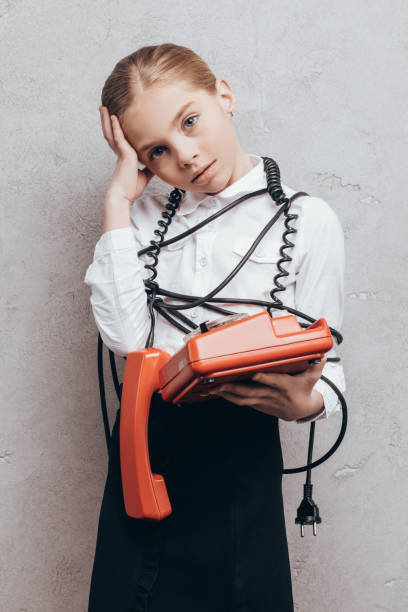 istock tired child with telephone 844125318