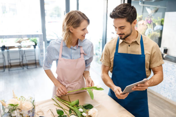 istock florists with digital tablet in flower shop 844125792