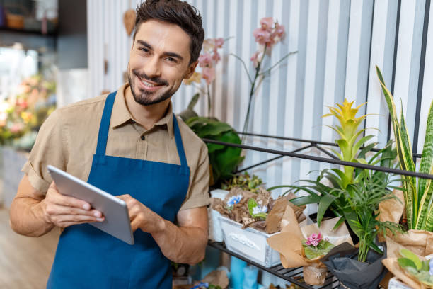 istock male florist with digital tablet 844126338