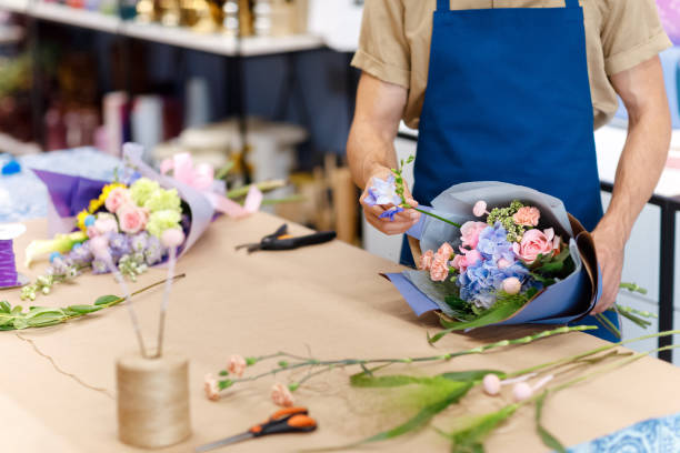 istock Florist working in flower shop 844129474