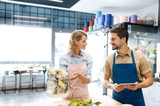 istock florists with digital tablet in flower shop 844129536