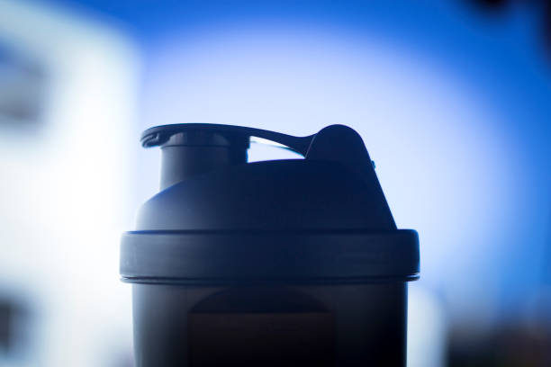 istock Protein shake shaker used to mix whey powder, glutamine, creatine and bcaa's for post training in bodybuilding and fitness gym routines 844129740