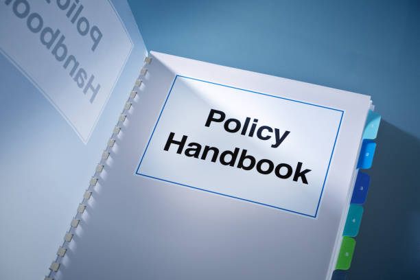A Corporate Policy Plan Document Manual Book Still Life A still life of a working Corporate Policy book. A fundamental document that guide a business venture, its organizational rules, its internal and external conducts and established policy for various conditions and situations. instruction manual photos stock pictures, royalty-free photos & images
