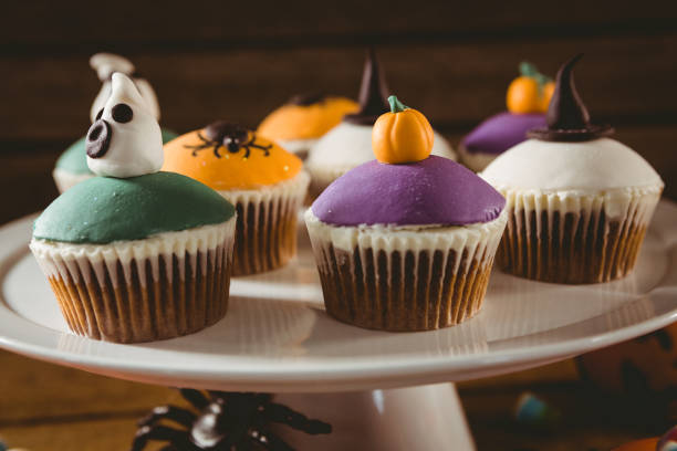 istock Close up of colorful cup cakes arranged on stand 844141046