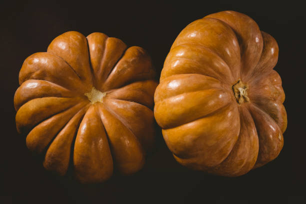 istock Close up of pumpkins against black background 844143678