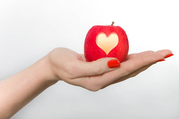 Red apple with heart shape of 2026 isolated on white